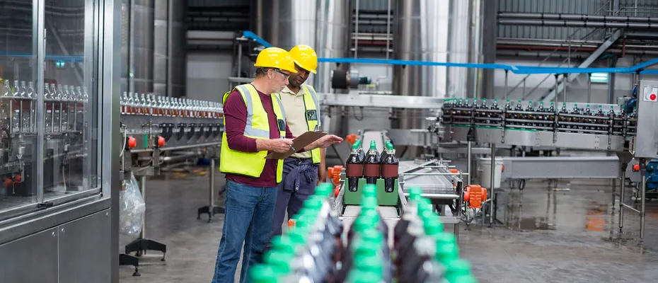 Two experts checking the quality of packaging on the production line